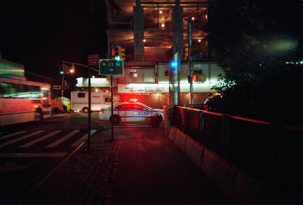 NYPD car with lights on